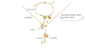 Detail view of golden necklace and bracelet set with gourd and Fu character charms