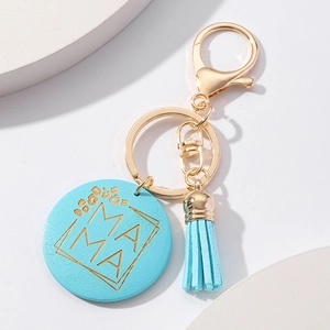 Detail of blue Mother's Day keychain with MAMA engraving and leather tassel