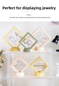 Macro detail of square PE film jewelry boxes in yellow, pink, and green on acrylic stands