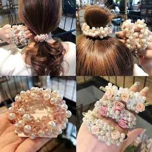 Elegant white fabric rose hair tie with pearls for ponytail and bun hairstyles