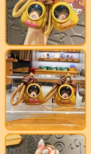 Detail of cute Kapibara light-up keychains with braided ropes and glowing charms