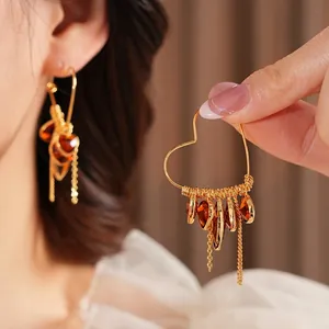 18K gold plated heart hoop earrings with amber glass teardrops and metal tassels