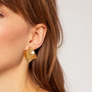 Chic 18K gold plated square earrings with woven grid texture on a model's ear