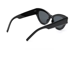 Detailed side view of glossy black cat-eye sunglasses with silver metal accents