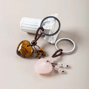 Tiger eye and rose quartz heart stone keychains with hand-woven rope and silver rings