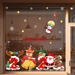 2025 Christmas window stickers with Santa, reindeer and snowman on glass shopfront