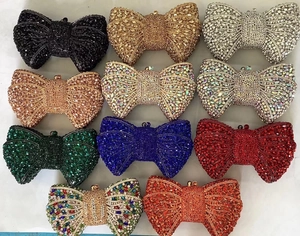 Selection of eleven sparkling crystal bow clutch bags in various vibrant colors