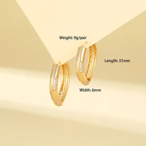 Golden geometric hoop earrings with sparkling zircon inlay and multi-row pave setting