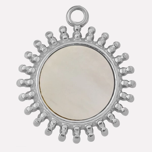Macro detail of sun-shaped 304 stainless steel pendant with white shell inlay