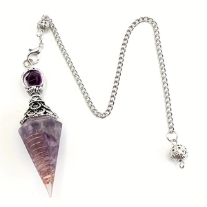 Macro shot of amethyst pendulum necklace with copper spiral wire and silver chain detail