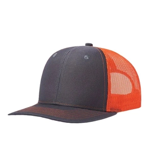 Outdoor trucker hat with dark grey front panel and bright orange mesh back with curved brim