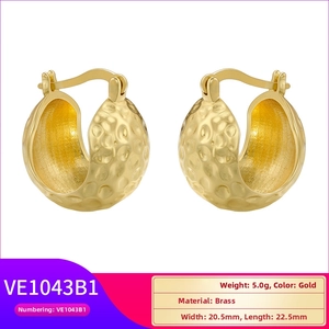 Detailed view of hammered gold brass earrings showing metal texture and size parameters