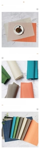 Gros plan de sets de table en PVC pliables montrant le tissage dense et le rangement facile