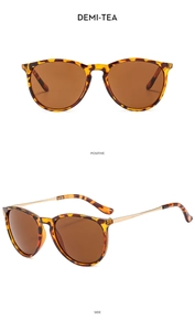 Detail view of demi-tea round sunglasses with golden metal temples and brown lenses