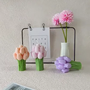 Pastel tulip-shaped scented candles in pink and purple colors for home decoration