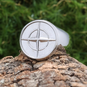 Compass compass rose stainless steel signet ring for men on rustic natural bark background