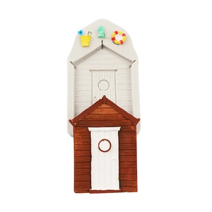 Detail of beach house silicone mold with miniature buckets and lifesaver shapes