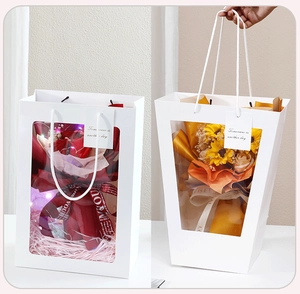 White trapezoid gift bag with transparent PVC window and cotton rope handle detail