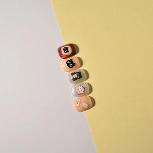 3D embossed nail art stickers with black bear, cake, and sweet chef designs on 5-piece tips