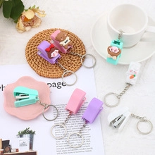 Mini stapler keychain set in pastel colors with cute cartoon animal character toppers