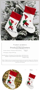 Detailed fabric Christmas stocking with Santa Claus patterns and specific dimensions shown