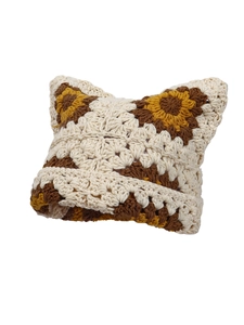 Close-up of handmade crochet cat ear beanie featuring colorful grandma square patterns