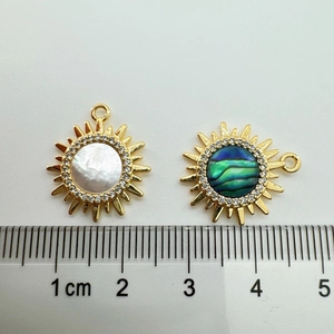 Detailed size view of 18K gold-plated sun charms with mother of pearl and abalone shell