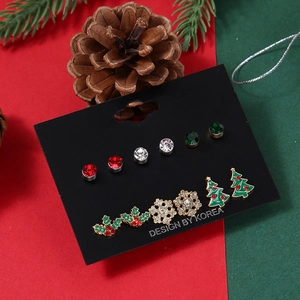 Christmas stud earring set featuring snowflakes and holiday trees in a festive red and green theme