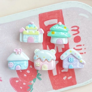 Five miniature pastel resin houses including castle and mushroom styles for DIY crafts