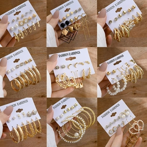 Detailed set of vintage gold geometric earrings with pearls and crystal rhinestones