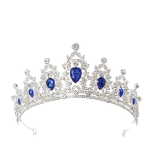 Detail of luxury crown with blue teardrop crystals and clear rhinestones on silver metal