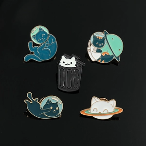 Detailed set of five astronaut cat enamel pins with space motifs on black background
