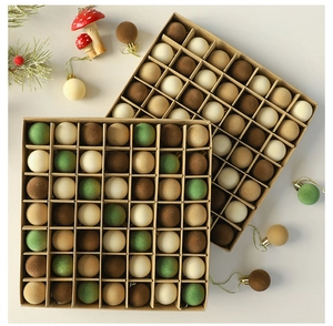 Detail of flocked velvet Christmas ball set in earthy tones with gold metal hooks