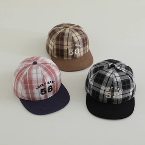 Detailed top view of three plaid flat-brim caps with Lucky Baby 58 embroidery detail