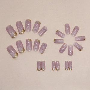 Elegant medium square marble press-on nails with pink base and golden glitter accents