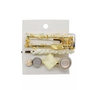 Three-piece pearl hair clip set with gold foil resin and geometric star charms