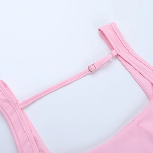 Close-up of pink dress adjustable shoulder strap with functional metal buckle detail