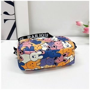 Detail of cute cartoon rabbit crossbody bag with wide letter-printed shoulder strap