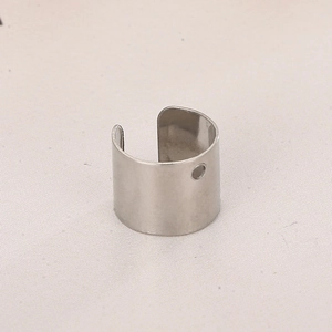 Detail view of silver stainless steel star hollow earring clip with a small positioning hole
