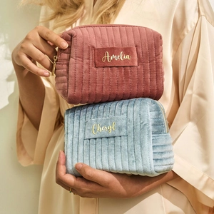 Customized velvet cosmetic bags in pink and blue with personalized name embroidery