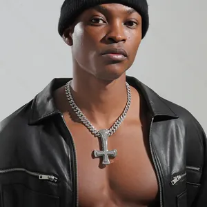 Detail of hip hop inverted cross pendant with iced out cubic zirconia on Cuban chain