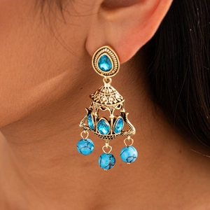 Elegant gold chandelier earrings with blue stones and turquoise beads in a retro ethnic style