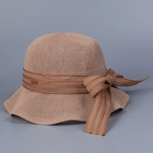 Detailed view of khaki knitted sun hat featuring a textured weave and elegant ribbon bow