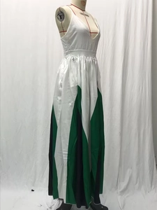 Detail of color-block pleated maxi dress with deep V-neck and satin-like finish