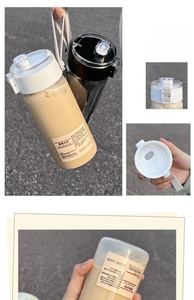 Detail of portable plastic sport water bottle showing flip-top lid and carry strap