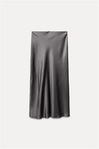 Detailed view of dark grey satin midi skirt showing premium silky texture and drape