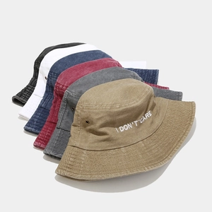 Washed cotton bucket hats in six colors featuring I DON'T CARE embroidery for unisex style