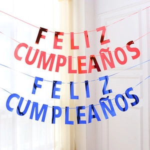 Detail of red and blue metallic Feliz Cumpleaños birthday banners with cutout letters