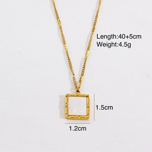 Detailed view of 14k gold plated necklace with shell inlay and 1.5cm x 1.2cm pendant