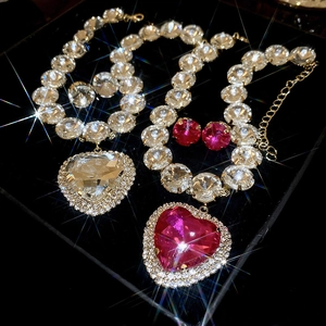 Detail of crystal heart necklaces and earrings featuring shimmering rhinestones